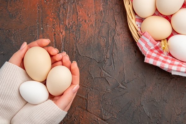 top view white chicken eggs inside basket with towel on dark table food animal farm breakfast color photo meal raw - Печёночные оладьи