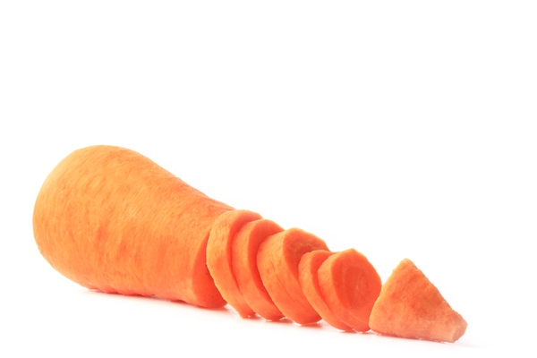 peeled carrot sliced isolated on a white surface - Постный смузи-боул из моркови и манго