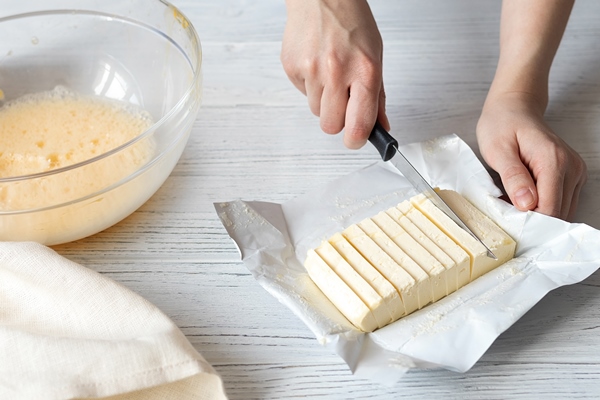 female hands slicing butter for homemade baking - Заварная пасха диетическая (при сахарном диабете)