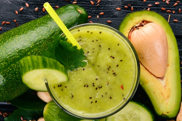 smoothie with avocado and cucumber with flaxseed and nuts on a wooden background top view free space for your - Смузи-боул из брокколи