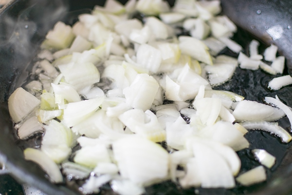 fried onions in a frying pan roasting the chopped onion in oil - Каша "Остатки сладки"
