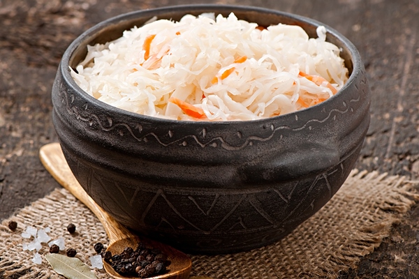sauerkraut with carrot in wooden bowl - Солянка "Тыловая"