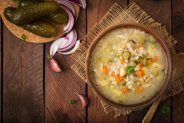 soup with pickled cucumbers and pearl barley rassolnik on a wooden background top view - Меню армейской кухни царской России