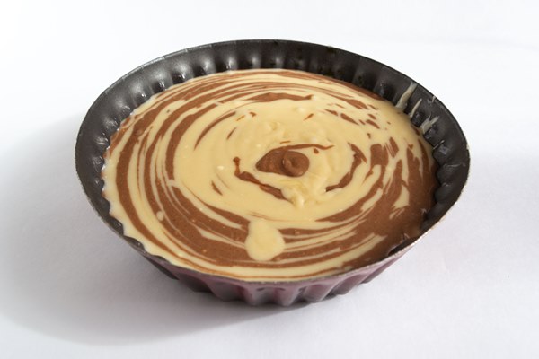 raw dough and chocolate dough are mixed in a baking dish homemade pie that is called zebra - Торт "Зебра"