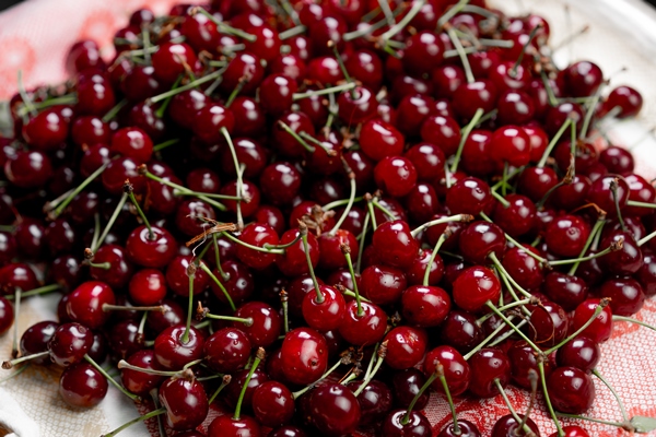 ripe cherry as background and - Вишнёвое варенье с косточками
