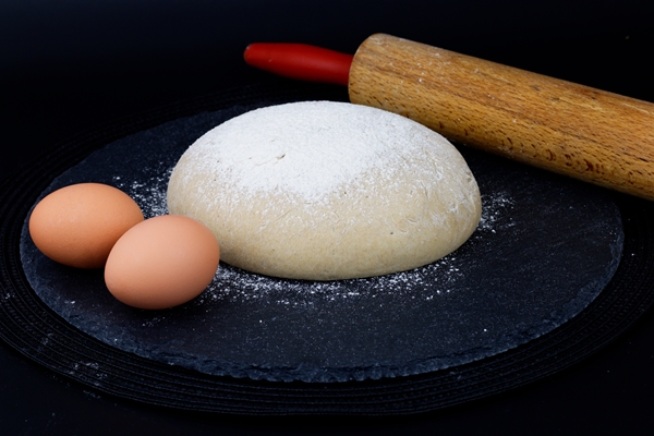 homemade organic dough for pizza or bread on black slate stone plate - Пицца "Маргарита"