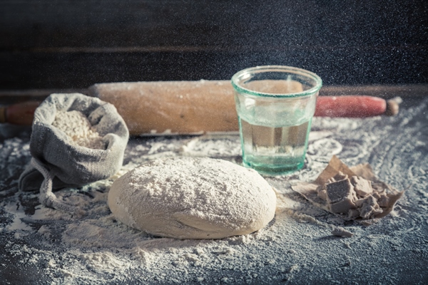 preparation for baking delicious and traditionally dough for pizza - Пицца "Четыре сыра"