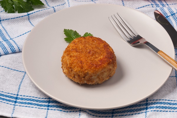 round chicken cutlet with stuffing decorated with greens zraza - Картофельные зразы с овощной начинкой
