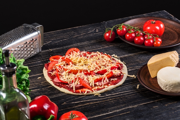 raw dough for pizza preparation with ingredient tomato sauce mozzarella tomatoes basil olive oil cheese spices served on rustic wooden table flat lay style italian pizza - Пицца "Сицилийская"