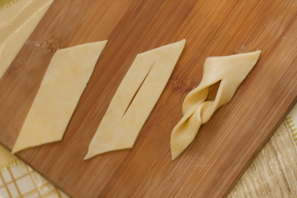 stages of cookie preparation brushwood from dough on a cutting board in vertical format - Печенье "Хворост"