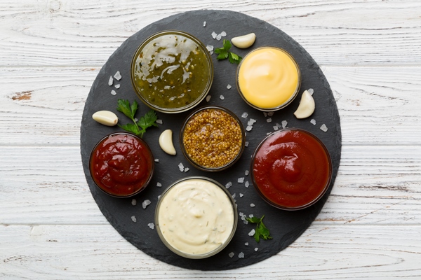 many different sauces and herbs on table flat lay top view sauces on plate healthy concept - Рекомендации по расчёту банкетных блюд и напитков