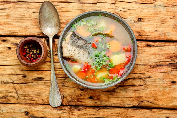 plate with fish soup on a wooden rustic table russian cossack fish soup - Старинные секреты приготовления скоромных и постных супов
