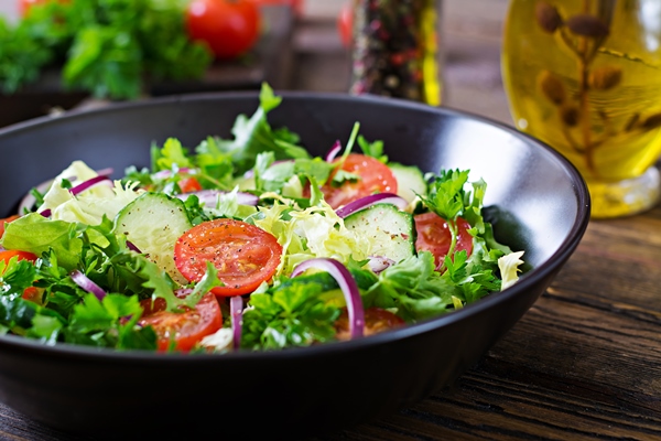 salad from tomatoes cucumber red onions and lettuce leaves healthy summer vitamin menu vegan vegetable food vegetarian dinner table - Рекомендации по расчёту банкетных блюд и напитков