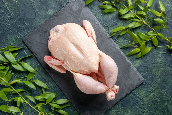 top view fresh raw chicken with green leaves on dark background chicken meal animal meat photo food color kitchen 1 - Красный сборный бульон по-румынски