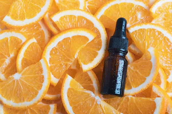 essential aroma oil or serum essence with fresh orange citrus fruits - Морской хлеб