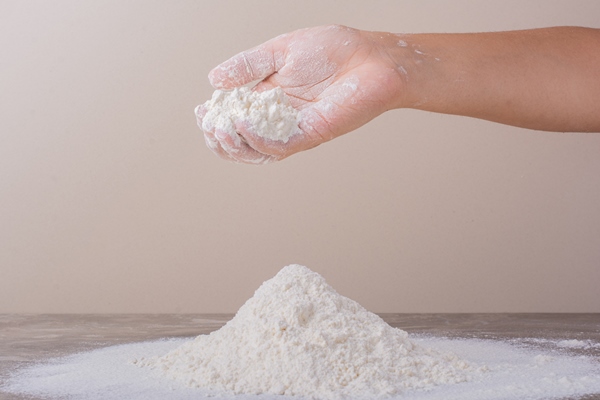 putting flour on ground for dough making - Рогалики по ГОСТу