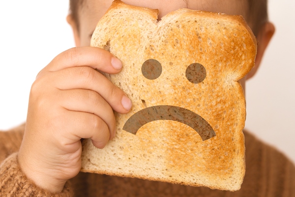 children and gluten preschool boy with toasted bread with sad emoji gluten intolerance by kids - Бородинский хлеб: история и современность
