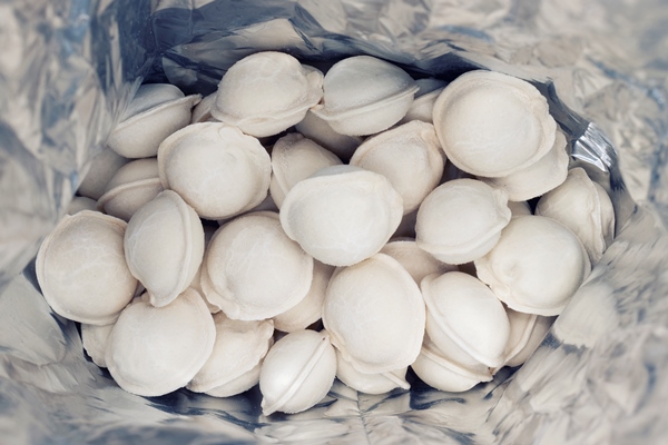 dumplings inside packaging closeup frozen homemade russian pelmeni - Пельмени