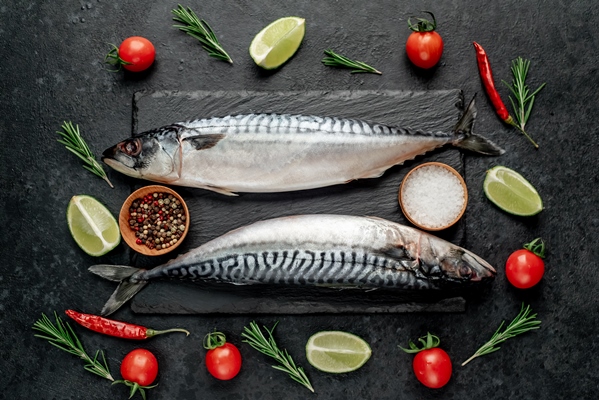 fresh raw mackerel fish on stone background - Пельмени с рыбной начинкой