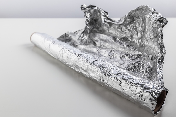 roll of aluminum foil isolated on white background - Постная галета с мандаринами