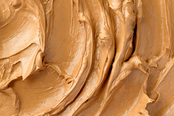 caramel frosting texture background close up - Восточный шербет с орехами