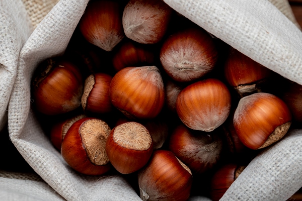 top view of hazelnuts in shell in a sack - Восточный шербет с орехами
