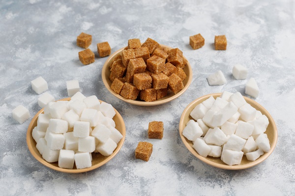 various types of sugar brown sugar and white on concrete top view - Восточный шербет с орехами