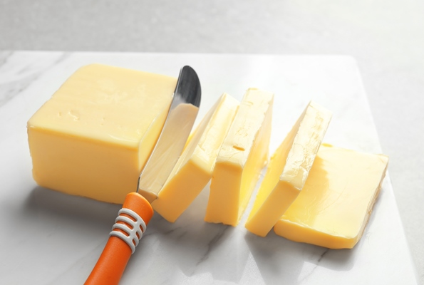cut block of butter on stone board - Хозяйке на заметку: виды кухонных ножей