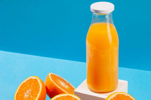 high angle orange juice bottle - Апельсиновая салатная заправка