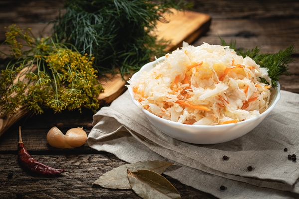 vegan food vegan food sauerkraut with carrots on a wooden surface eco vegetables with carrots on a wooden surface - Православная поминальная трапеза