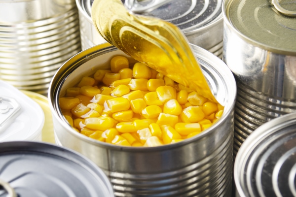 canned sweet corn in just opened tin can nonperishable food - Кукуруза сахарная (школьное питание)