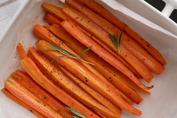 close up on vegetables in kitchen - Морковь отварная дольками (школьное питание)