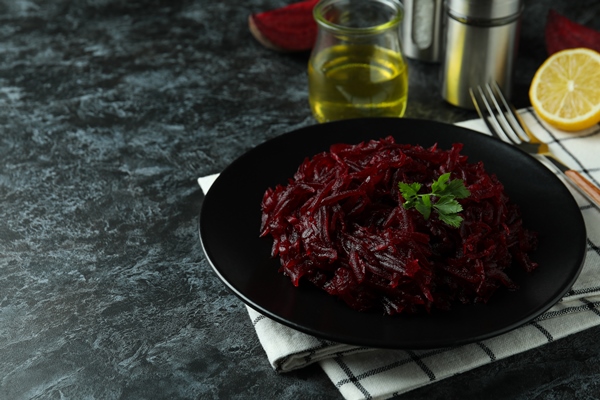 concept of tasty eating with beet salad on black smoky table 2 - Тушёная свёкла со сметаной и ламинарией (школьное питание)