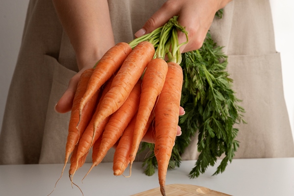 raw carrot at the kitchen 1 - Салат из моркови с черносливом (школьное питание)