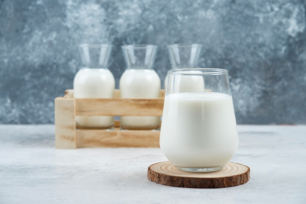 a glasses of milk on a gray table - Каша "Дружба" (школьное питание)