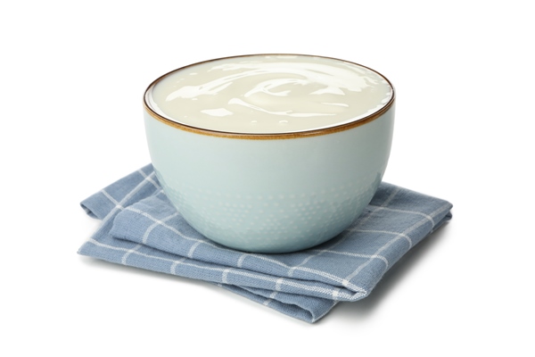 bowl of sour cream yogurt and napkin isolated on white - Рагу из овощей с кабачками (школьное питание)