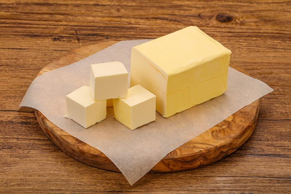 dairy natural yellow butter piece 1 - Каша гречневая с молоком, жидкая (школьное питание)