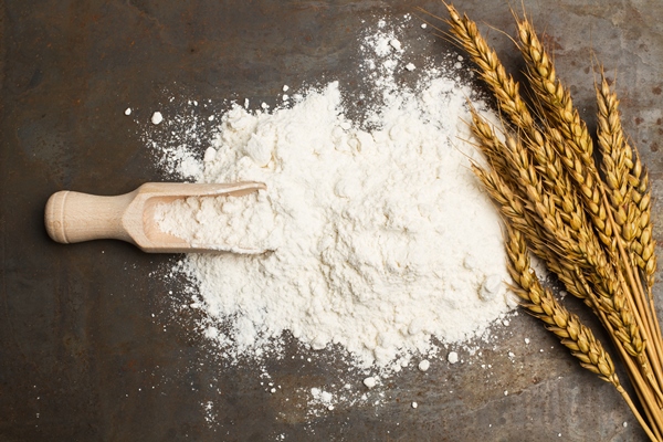 flour and wheat stalks on a metal table - Щи из свежей капусты со сметаной (школьное питание)