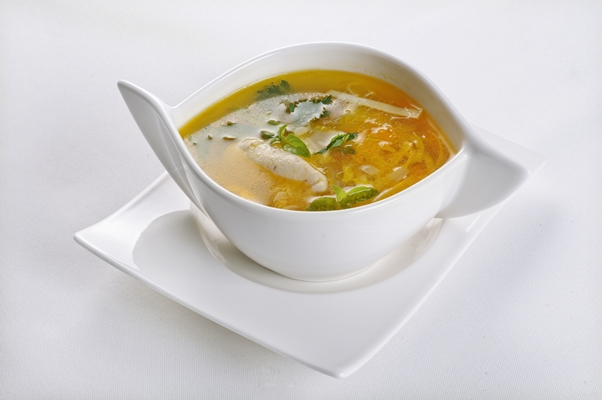 isolated shot of a white bowl with hot and sour soup perfect for a food blog or menu usage - Суп крестьянский с перловой крупой (школьное питание)