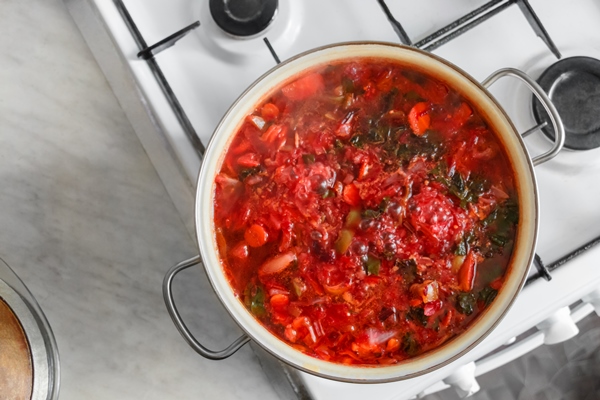 pan of vegetable soup on gas stove - Борщ с фасолью (школьное питание)
