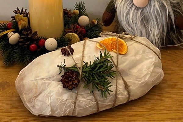 stollen and christmas decoration on the table rotated e1702998486561 - Марципановый штоллен