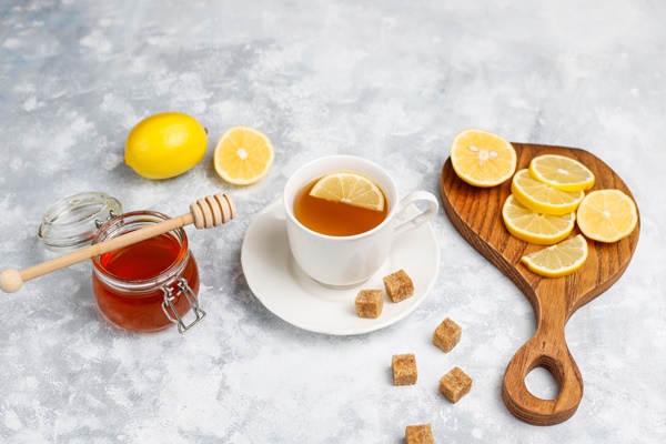a cup of tea brown sugar honey and lemon on concrete top view copy space - Чай с лимоном и мёдом (школьное питание)