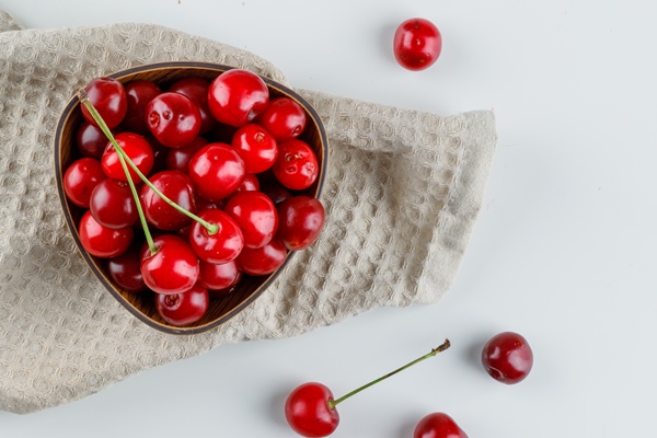 cherries in a bowl on white and kitchen towel 1 - Соус вишнёвый (школьное питание)