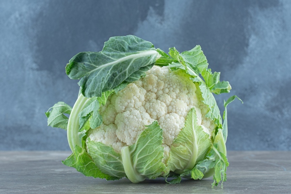 close up photo of green fresh cauliflower on grey table - Щи монастырские богатые