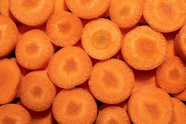 close up texture of carrots - Рыба с овощами в сметане
