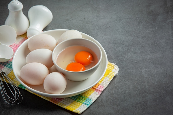 duck eggs on dark surface - Омлет с сыром (школьное питание)