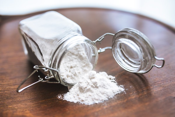 flour on the table and in a glass jar - Кисель из брусники (школьное питание)