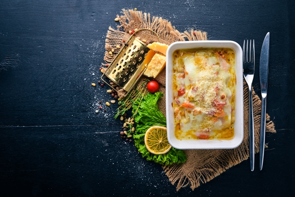 lasagna italian cuisine top view free space for text on a wooden background 1 - Паровое суфле из пикши