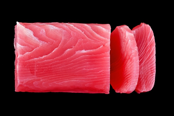 raw tuna fish isolated on black background - Плов с тунцом