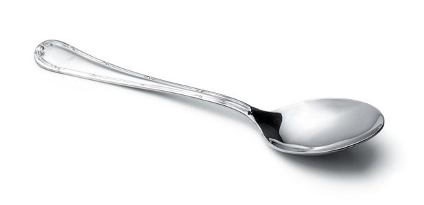 silver shiny spoon isolated on white surface - Секреты приготовления киселей на крахмале